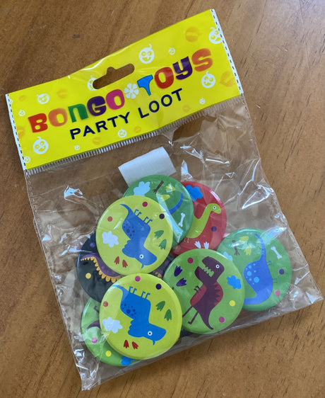 Colorful dinosaur badges in a pack of 10, ideal for party favours and collectibles for any dinosaur-themed celebration.