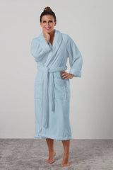 Light blue Manor robe by BAKSANA, featuring a shawl collar, two pockets, and a waist tie, crafted from 100% polyester.