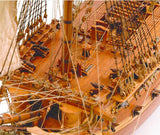 Wooden ship model kit of San Juan Nepomuceno, detailed design, laser-cut parts, and multilingual instructions for assembly.