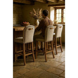 AMBERLEY FABRIC BENCH HEIGHT BARSTOOL W/ LEATHER HANDLE & STUDS