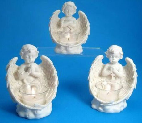 Set of 3 assorted kneeling cherub tea light holders, enhancing ambiance and elegance in any room.