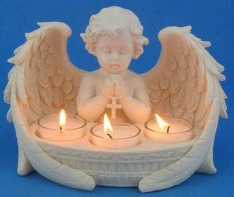 Praying cherub tea light holder, 21cm tall, holds three candles, combining elegance and tranquility in home decor.