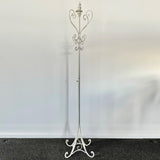 Elegant cream wrought iron coat stand, 178cm tall, features ample hanging space and timeless design for versatile decor.