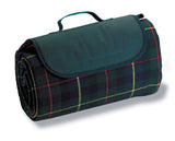 Vibrant green picnic rug with waterproof backing, spacious for outdoor gatherings, featuring a carry handle and Velcro closure.