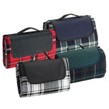 Spacious green picnic rug with waterproof backing, velcro closure, and carry handle for outdoor adventures.