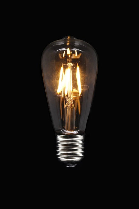 Dimmable ST64 LED bulb with warm white glow, ideal for creating ambiance in decorative fixtures.