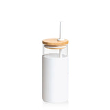 Elegant white borosilicate glass bottle with bamboo lid, silicone sleeve, and matching straw for stylish hydration.