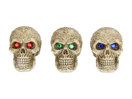 Colorful-eyed skull ornaments, 7cm each, in a pack of 12; perfect for Halloween or unique decor displays.