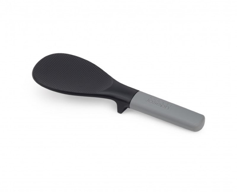 Joseph Joseph Elevate Fusion Rice Spoon with wide head for fluffing rice, integrated tool rest for mess-free serving.