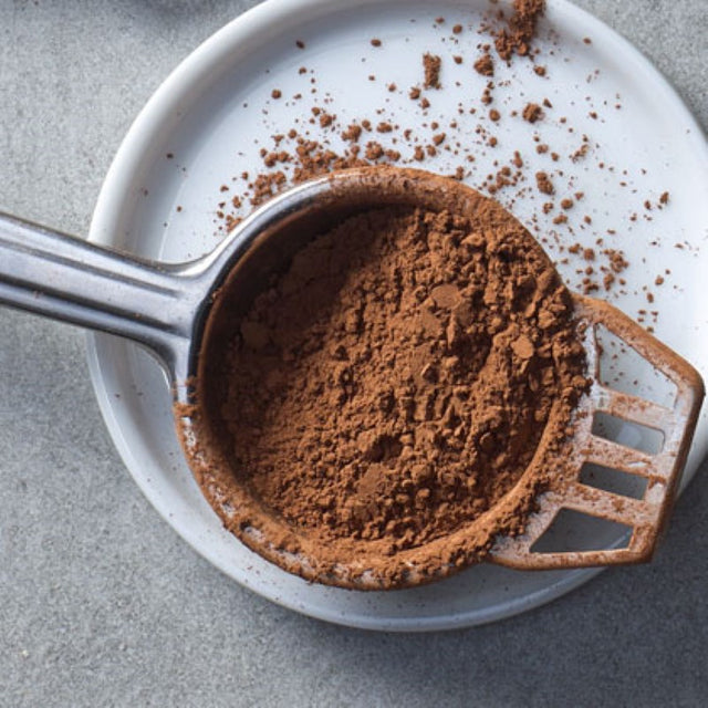 Rich Smart Choice Cocoa Powder in a 1KG pack, perfect for desserts, hot chocolates, and enhancing baked goods.