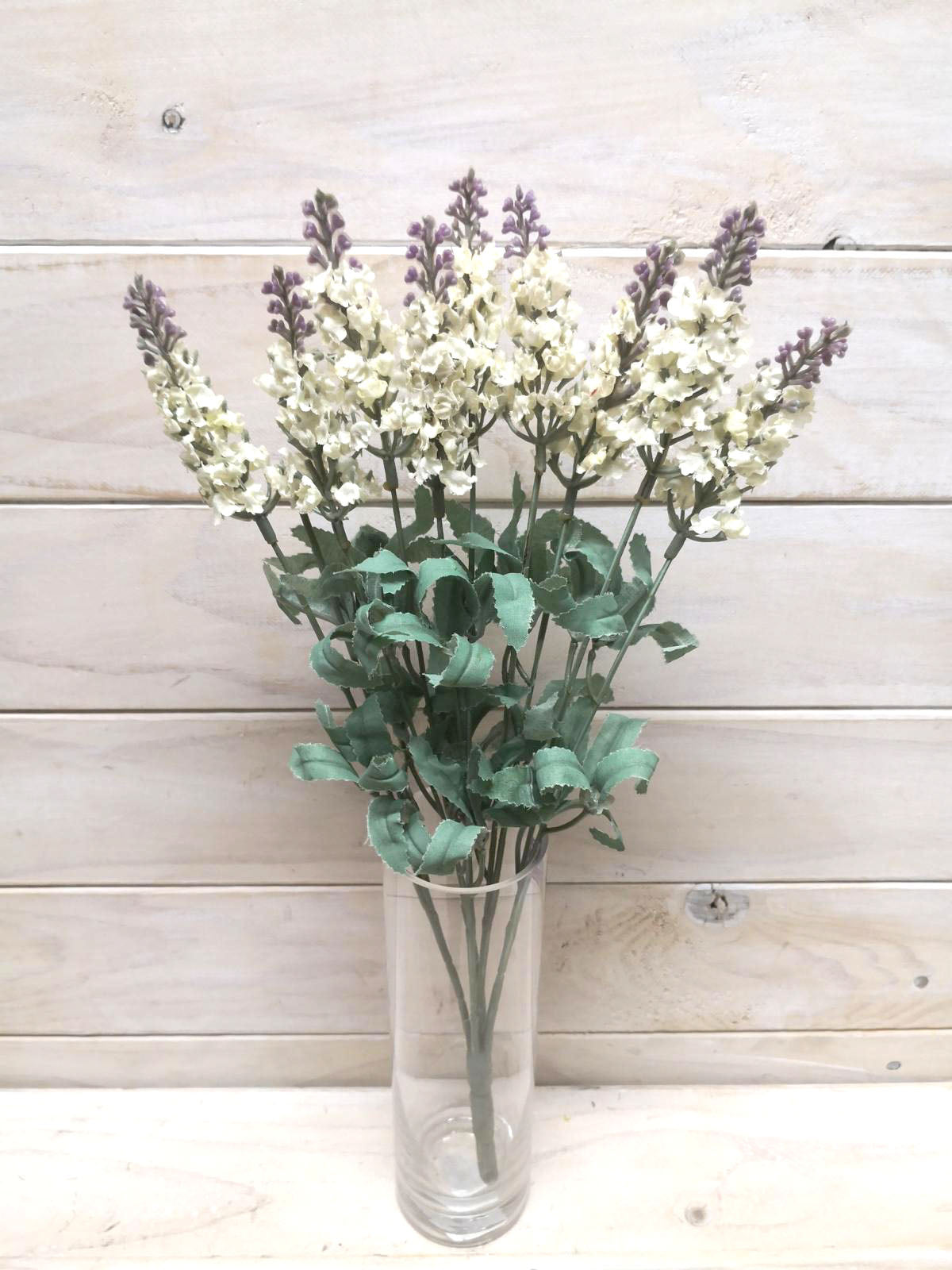 Vibrant purple blooms on a lush green bush, perfect for effortless, long-lasting home decor and elegant accents.