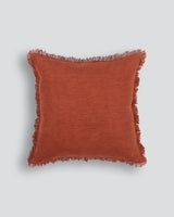 Otto Cushion in Olive, 50x50cm, featuring a textured design, fringed edge, and 100% cotton fabric.