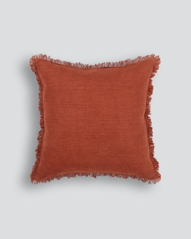 Otto Cushion in Olive, 50x50cm, featuring a textured design, fringed edge, and 100% cotton fabric.