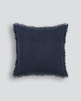 Olive green 50x50cm cotton cushion with fringed edges, perfect for adding texture to any decor.