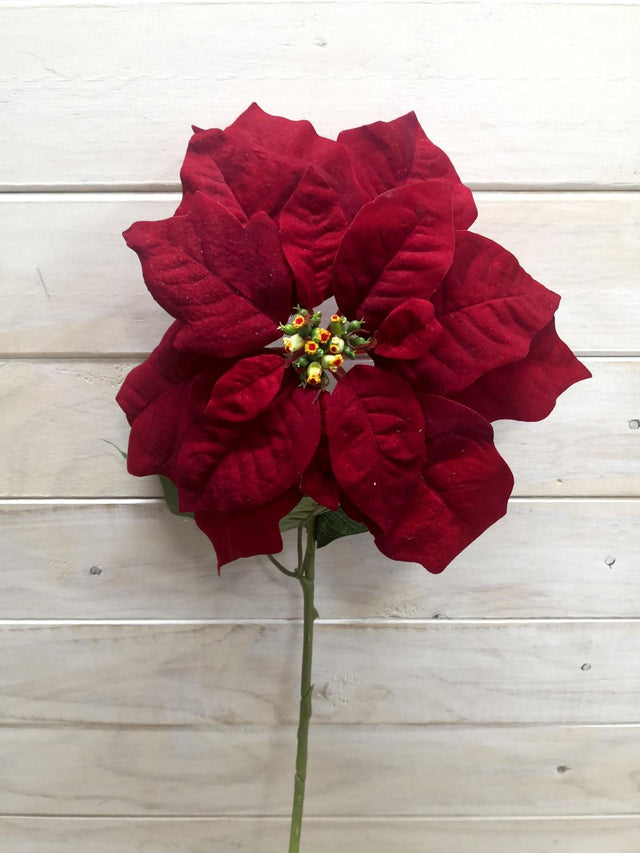 Large velvet poinsettia stem in rich colors, perfect for festive decor and year-round elegance without maintenance.