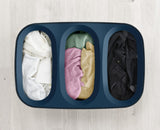 Joseph Joseph Tota Trio 90L Black laundry basket with three removable fabric bags for efficient color separation.