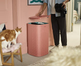 Stylish coral laundry basket with three separate 30L bags for easy sorting of light, dark, and colored fabrics.