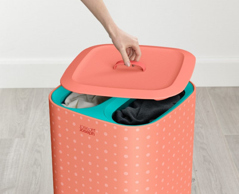 Joseph Joseph Tota Pop 60L Laundry Basket in Coral with three fabric totes for easy laundry sorting and transport.