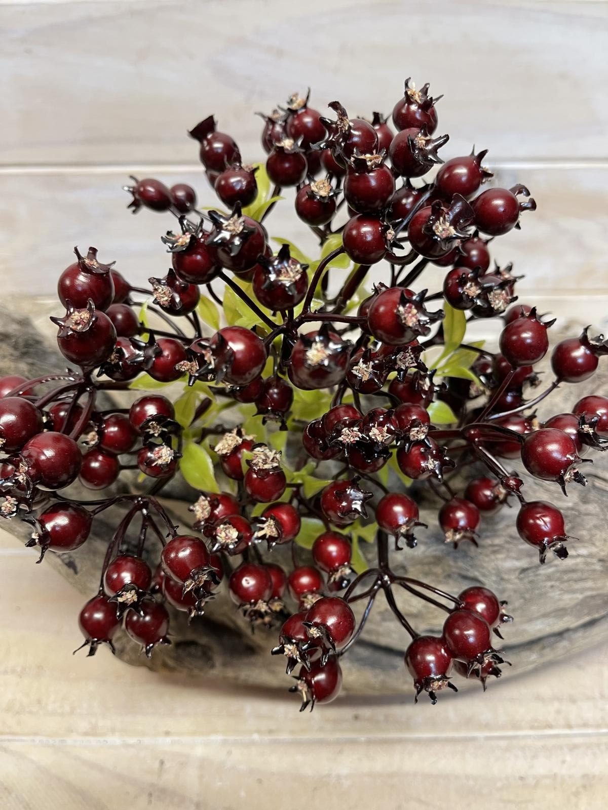 Artificial rosehip berry bundle featuring five vibrant, realistic faux berries for home decor and crafting.