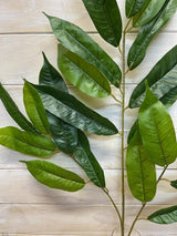 Lifelike long green mango leaf spray, ideal for vibrant tropical decor, easy to maintain and perfect for various arrangements.