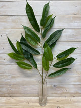 Lifelike long green mango leaf spray for vibrant tropical decor, perfect for arrangements and low-maintenance greenery.