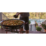 Paella gas burner set featuring a 46cm carbon steel pan, lightweight burner, and wheeled stand for outdoor cooking.