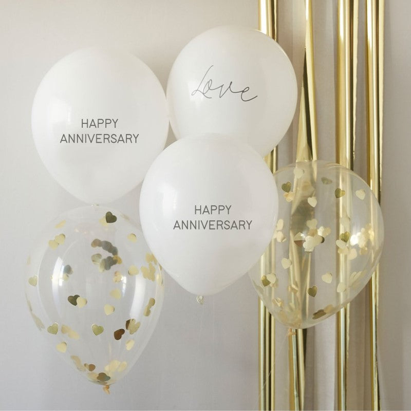 Anniversary balloon bundle featuring 'Happy Anniversary' and 'Love' balloons with gold heart confetti for elegant celebrations.