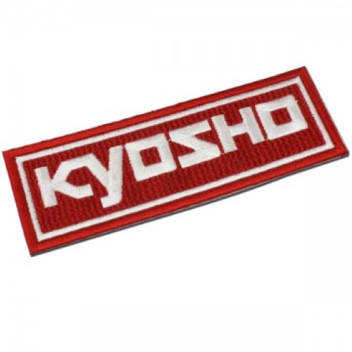 Kyosho Emblem 36x102 mm, premium hobby part for RC vehicles, enhancing aesthetics and performance with authentic branding.