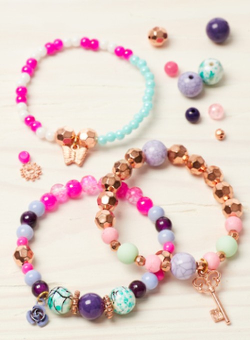 DIY charm bracelet kit with vibrant beads, playful charms, and matching tattoos for creative kids.