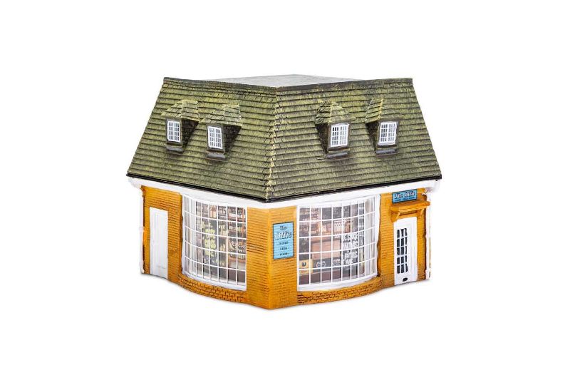 Miniature corner shop model by Hornby, capturing the charm of Cotswold market towns for 1/76 scale railway layouts.