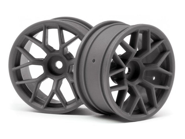 Sleek gunmetal 1/10 RC car with advanced tech, powerful motors, and durable chassis for high-speed outdoor and indoor racing.