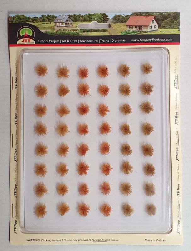 Realistic model grass set with 48 textured clumps, ideal for enhancing dioramas and railway layouts with vibrant colors.