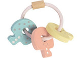 PlanToys Key Rattle in pastel colors for infants, promoting sensory exploration and fine motor skills development.