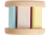 Wooden pastel roller toy for toddlers, designed for imaginative play, sensory development, and auditory stimulation.