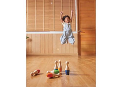 Colorful PlanToys Bowling Set for kids, crafted from eco-friendly materials, promoting motor skills and imaginative play.
