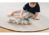 Colorful wooden stacking train set for toddlers, enhancing fine motor skills and imaginative play. Eco-friendly and safe.