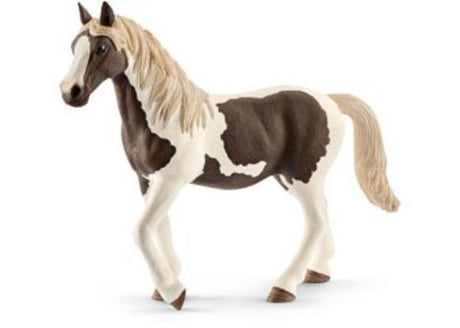 Schleich Pinto mare figurine featuring intricate coat patterns, ideal for imaginative play and nature exploration for kids.
