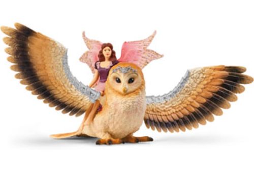 A beautiful fairy rides a majestic glam-owl, showcasing intricate details perfect for imaginative play and collection.