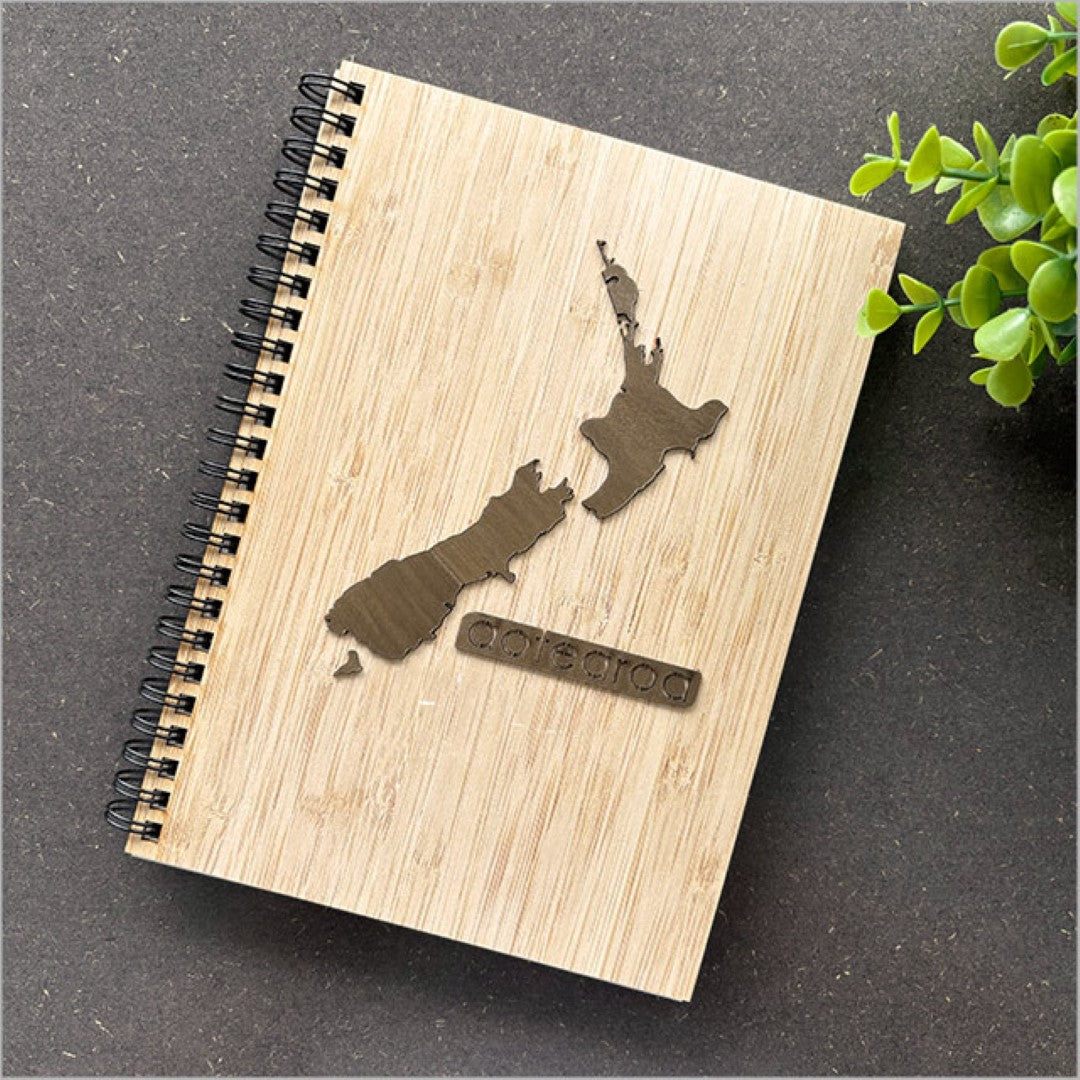 Small bamboo journal with NZ River Rimu veneer, featuring 110 pages of premium cartridge paper for versatile writing and creativity.