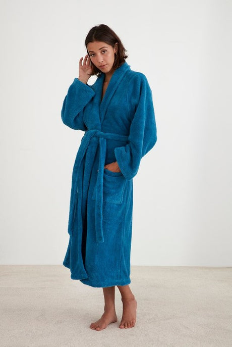 Cozy blue shawl collar bathrobe with pockets and waist tie, perfect for warmth and comfort (size L/XL).