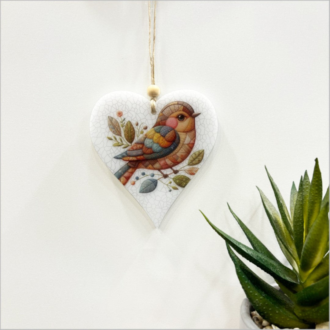 Hanging ornament featuring a heart-shaped bird design, crafted from 6mm thick satin acrylic, perfect for home decor.