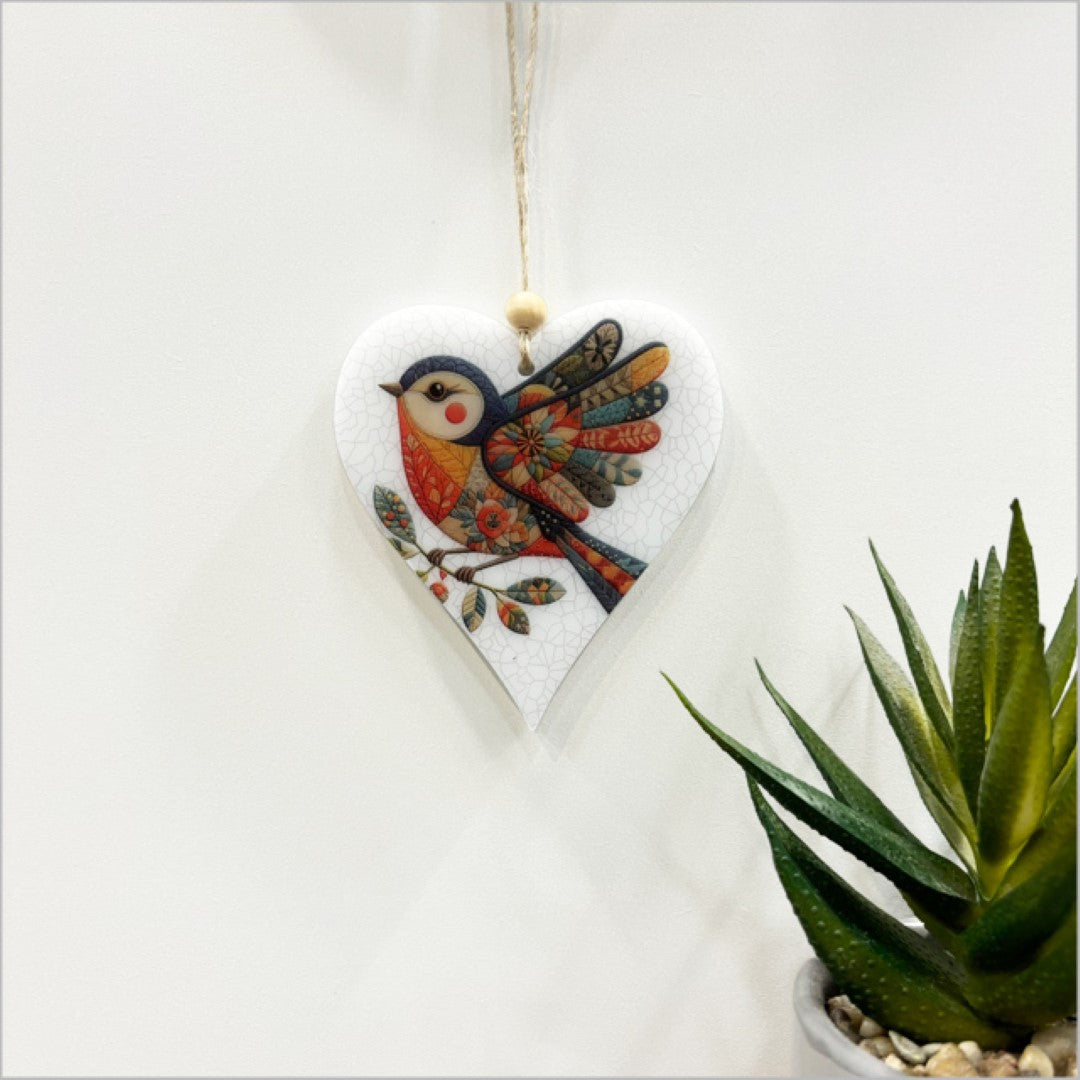 Elegant heart-shaped bird ornament with open wings, crafted from satin acrylic, perfect for home decor and gifting.