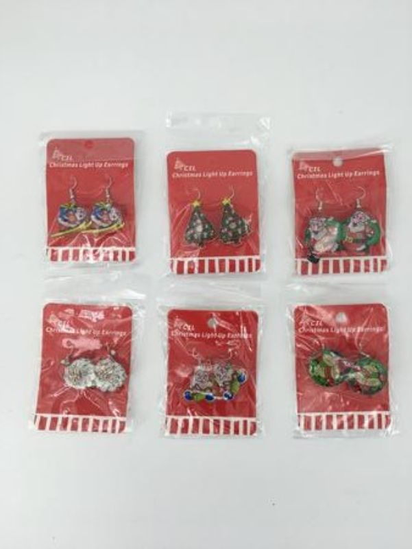 Colorful set of 12 assorted Christmas earrings for festive holiday accessorizing.