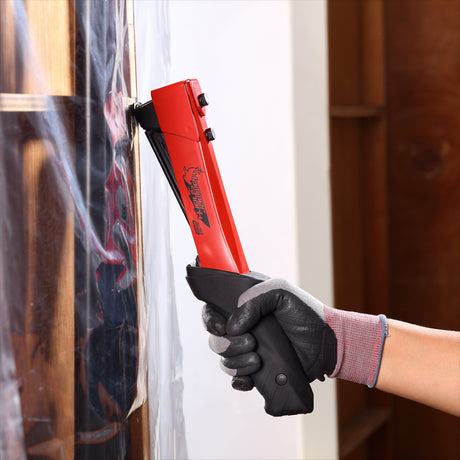 Heavy duty APEXON hammer tacker with ergonomic grip, bottom-loading staples, and all-steel construction for roofing and insulation.