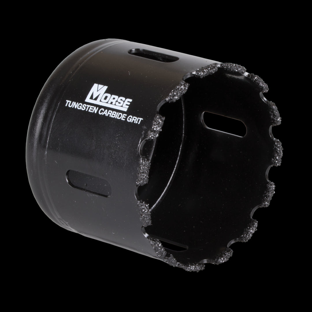 MORSE 64mm Tungsten Carbide Grit Holesaw cutting through concrete, designed for precision and durability in tough materials.