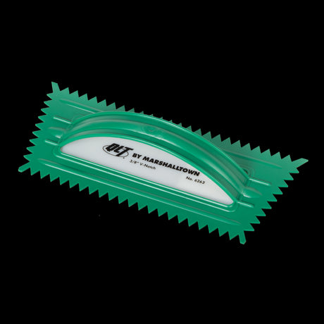 MARSHALLTOWN 10mm green plastic V-notched trowel for precise adhesive application on walls, floors, and tiles.