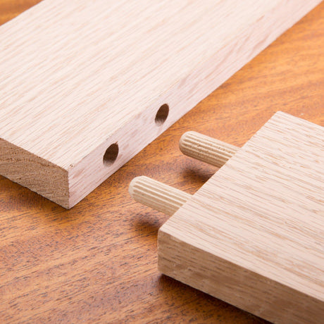 60-pack of 6mm fluted wooden dowels made of durable beech wood, ideal for strong and precise woodworking joints.