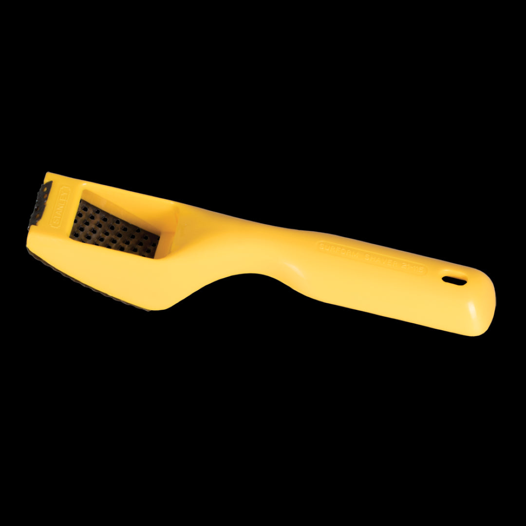 STANLEY 60mm Surform Shaver Tool with replaceable 63mm blade, ideal for shaping wood and materials like aluminum and plastic.