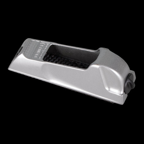 STANLEY 140mm Surform Block Plane with replaceable blade, ideal for shaping wood and various materials like aluminium and plastics.