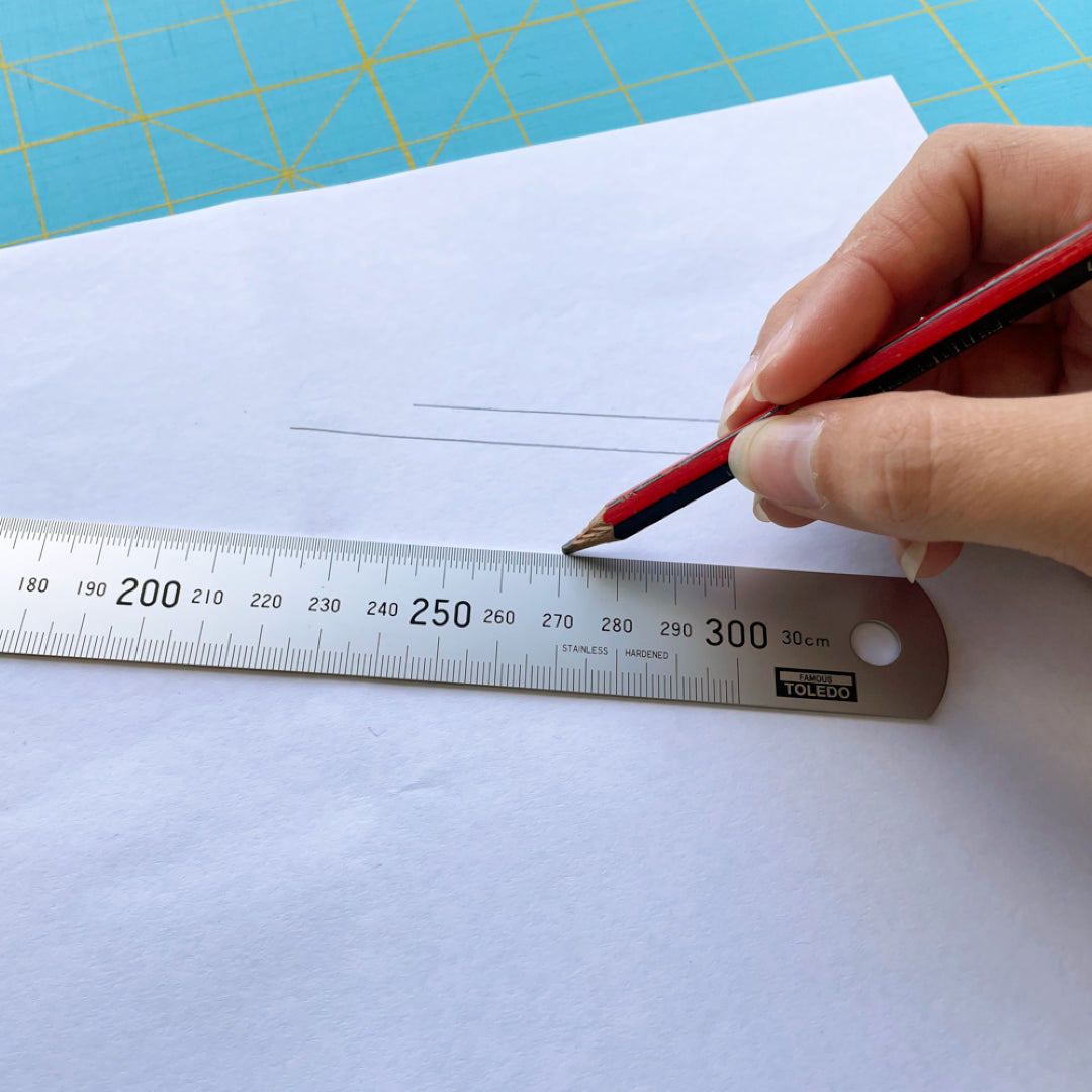 TOLEDO 300mm stainless steel ruler with metric and imperial measurements, featuring durable design and clear graduations for precision.